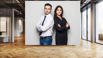 man and woman standing back to back on gray background Wall mural